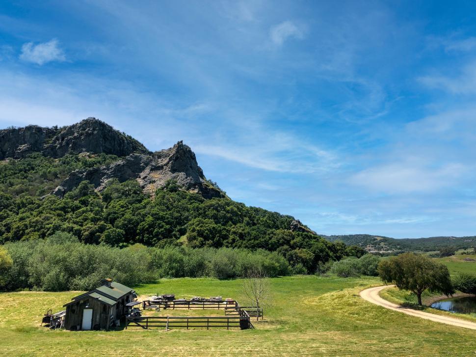 Free Image of Rural landscape with a mountainside and shack 