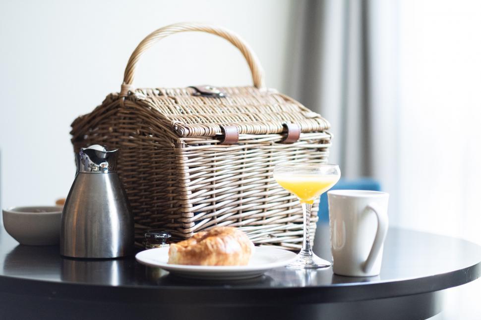 Free Image of Picnic Basket Setup with a Drink and Croissant 