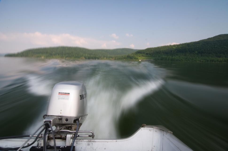 Free Image of Speeding boat engine on a serene lake 