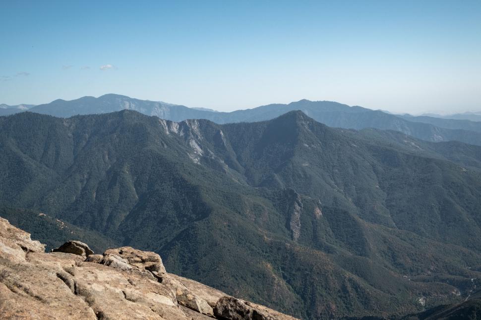 Free Image of Mountain range under a clear blue sky 