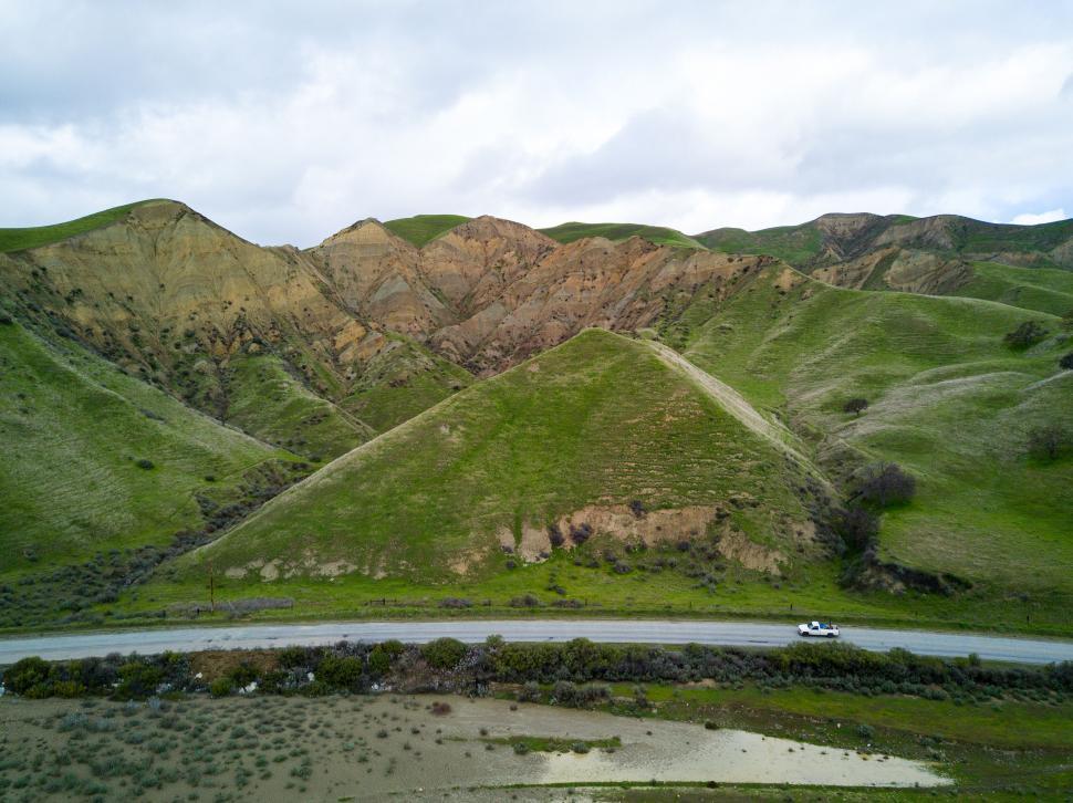 Free Image of Mountainous Green Landscape with Road 
