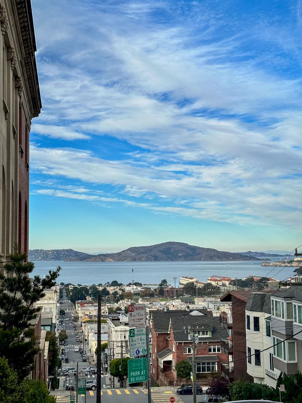 Free Image of Cityscape with a view of the sea and distant hills 