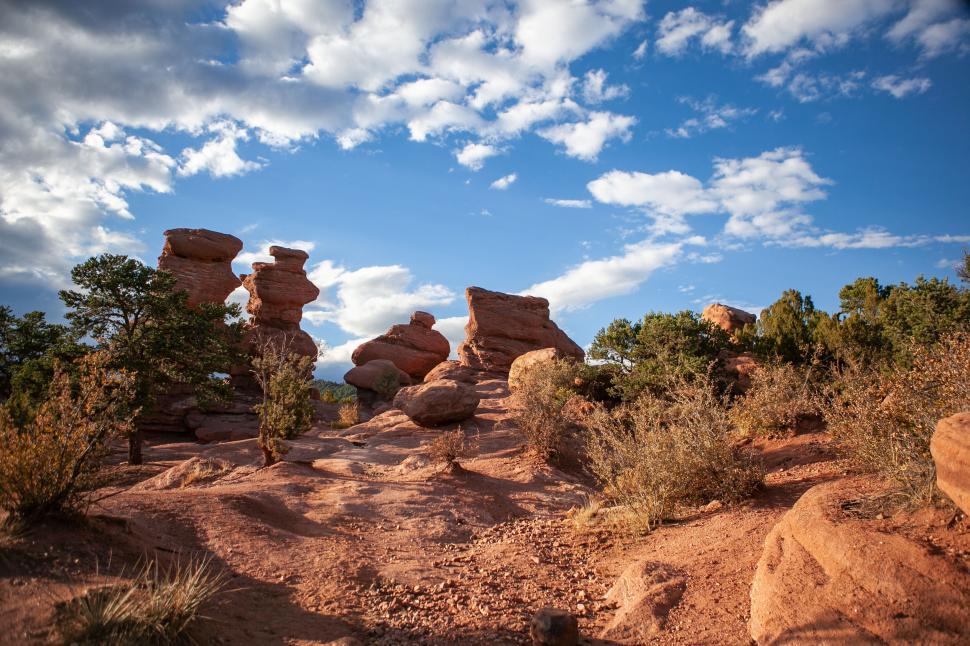 Free Image of Rock formations under a blue sky at sunset 