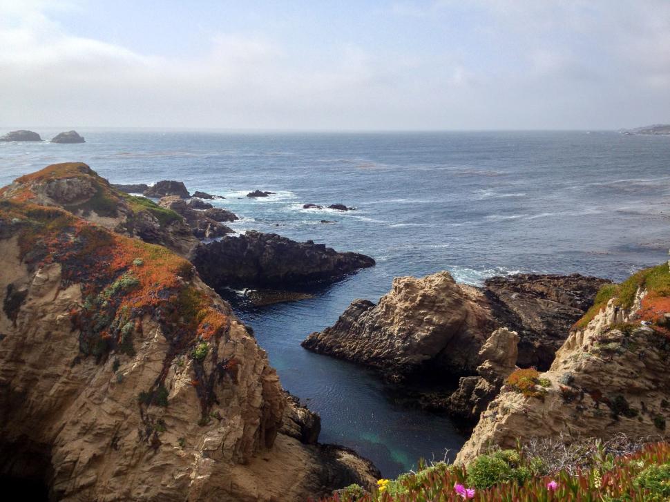 Free Image of Rugged coastline with rock formations and sea 