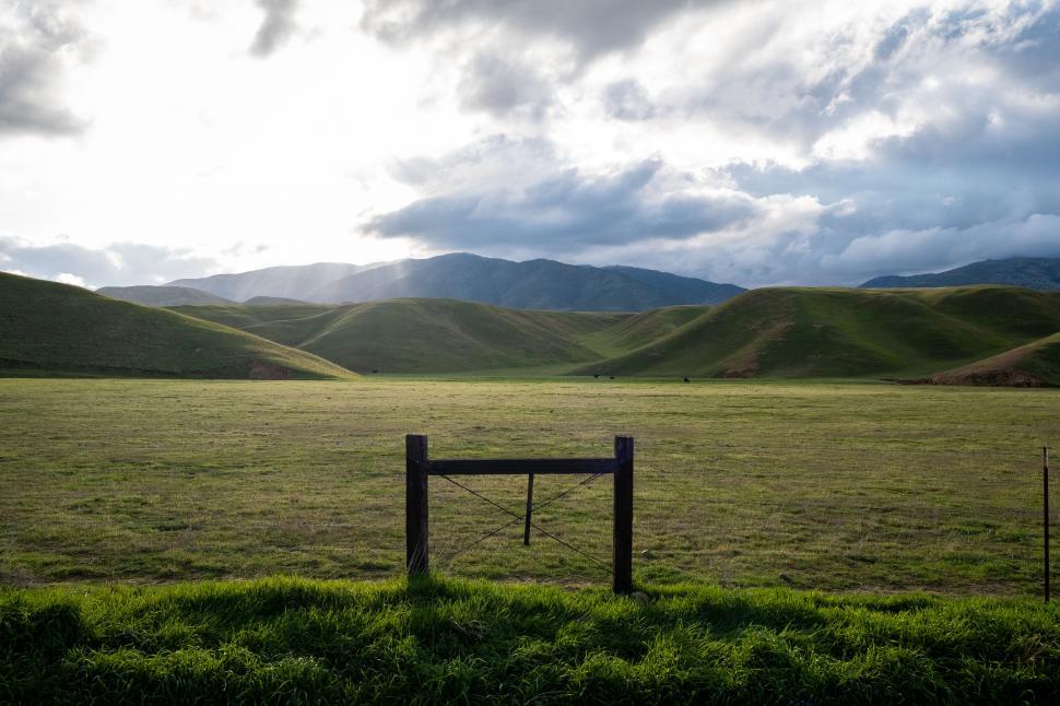 Free Image of Serene Pastoral Landscape with Fence 