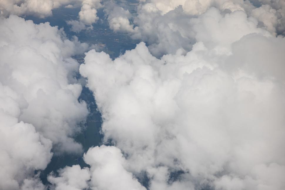 Free Image of Aerial view of white clouds and land 