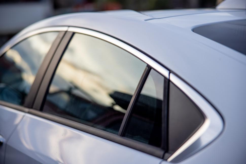 Free Image of Modern white car with sleek window design 