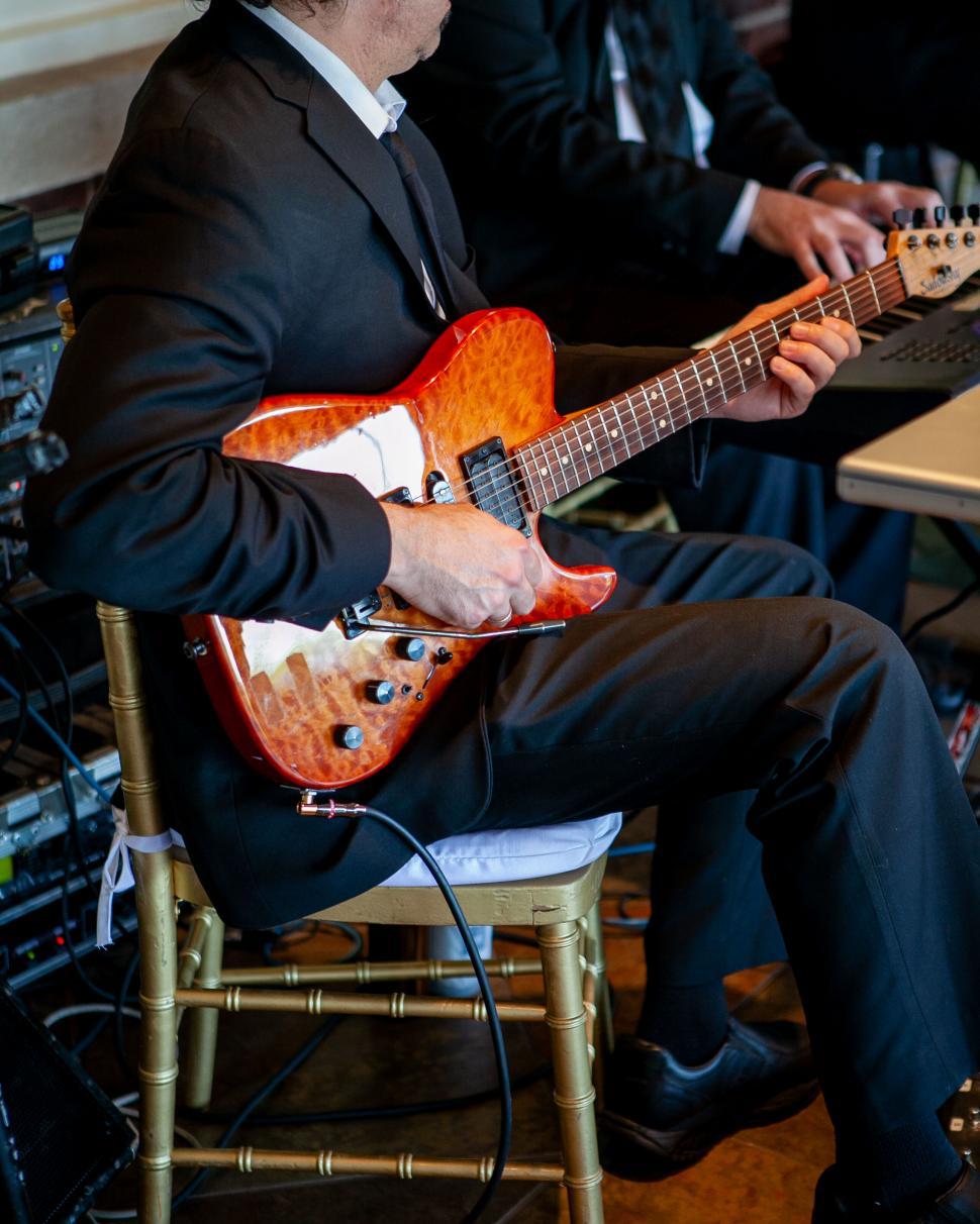 Free Image of Guitarist playing on stage during a concert 