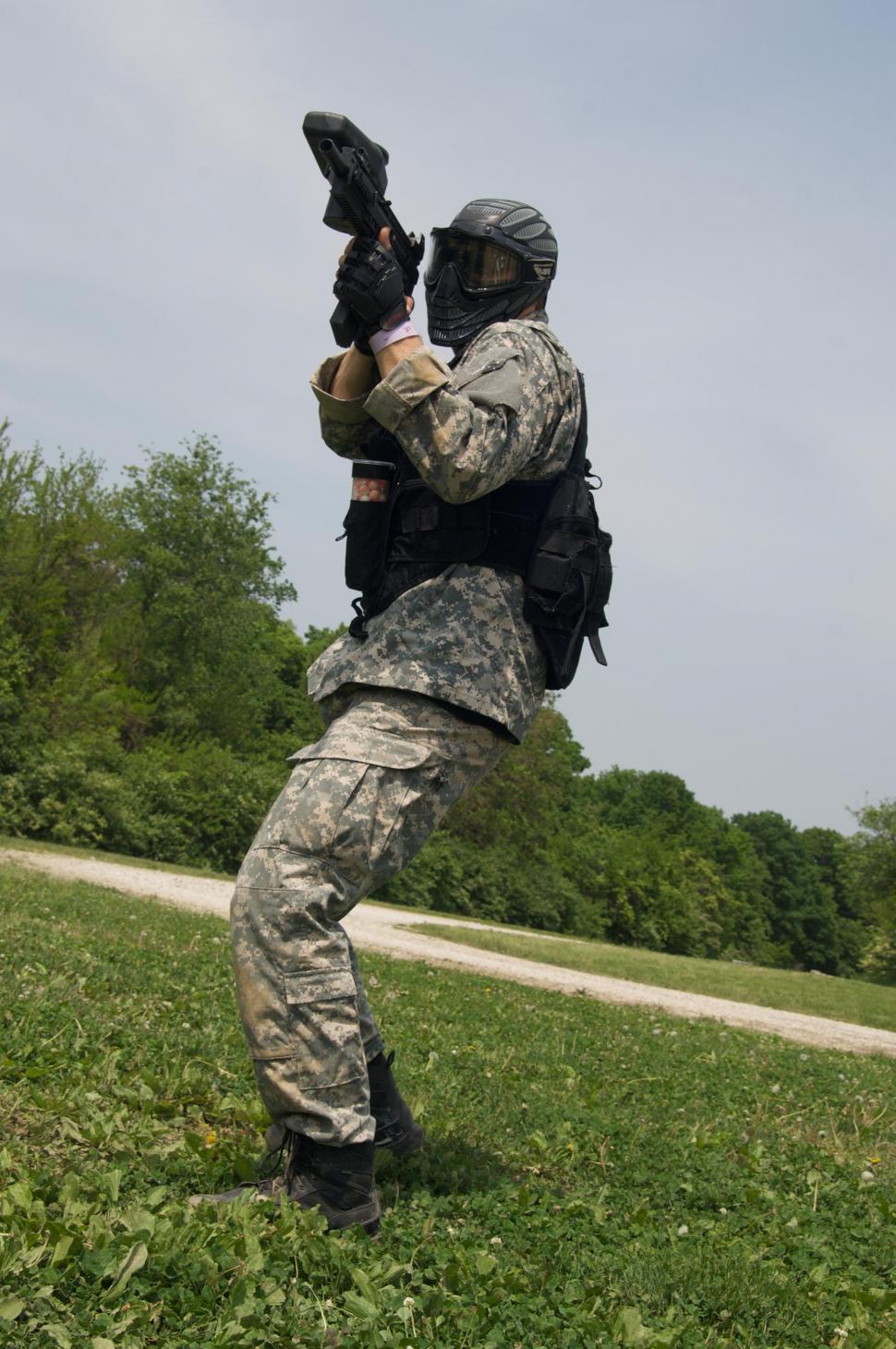 Free Image of Paintball player in the park 