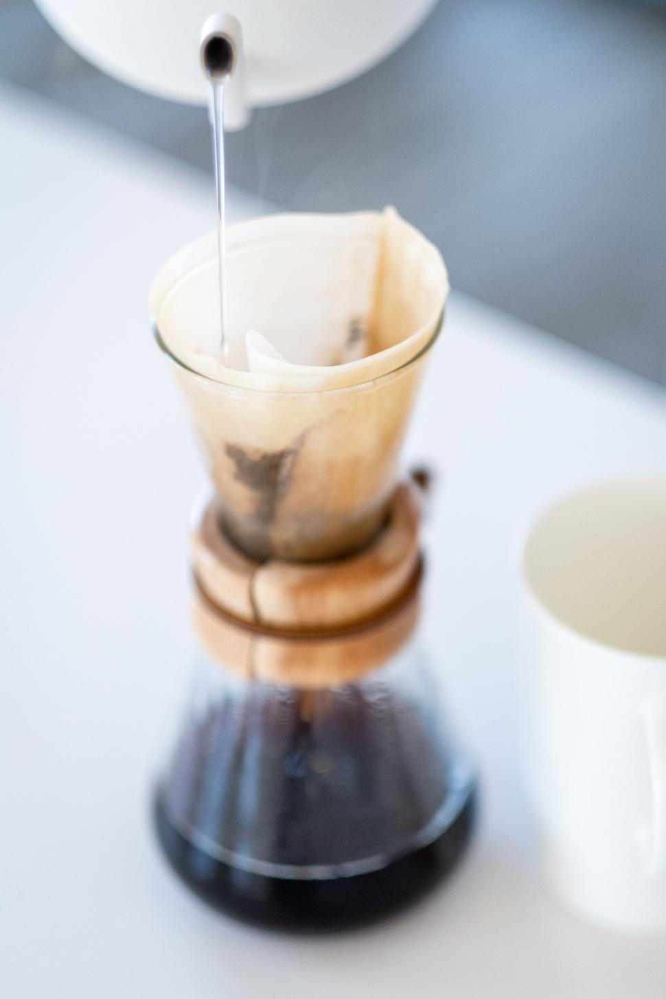 Free Image of Dripping Coffee into Chemex Brewer Close-up 