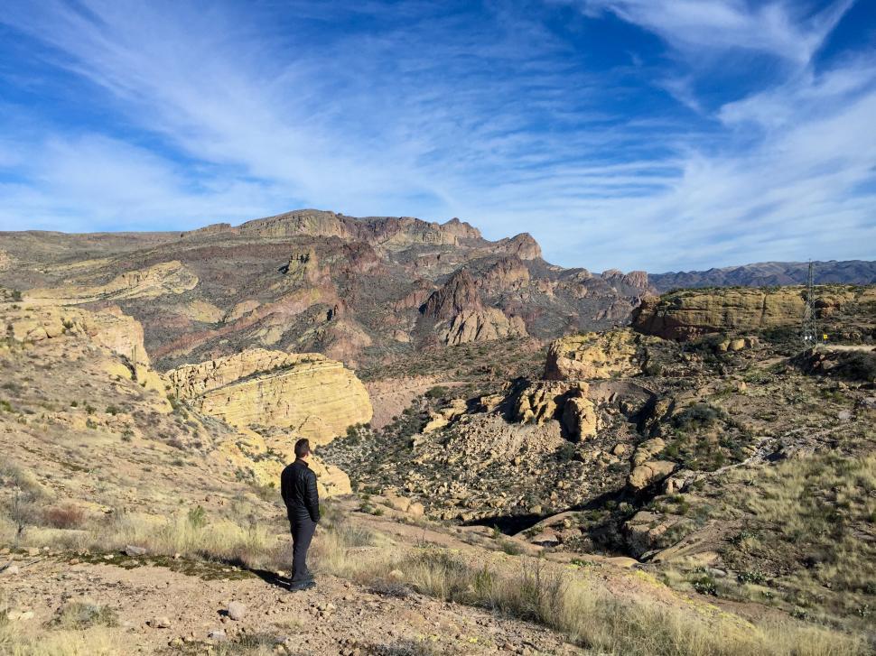 Free Image of Man hiking in expansive mountain terrain 