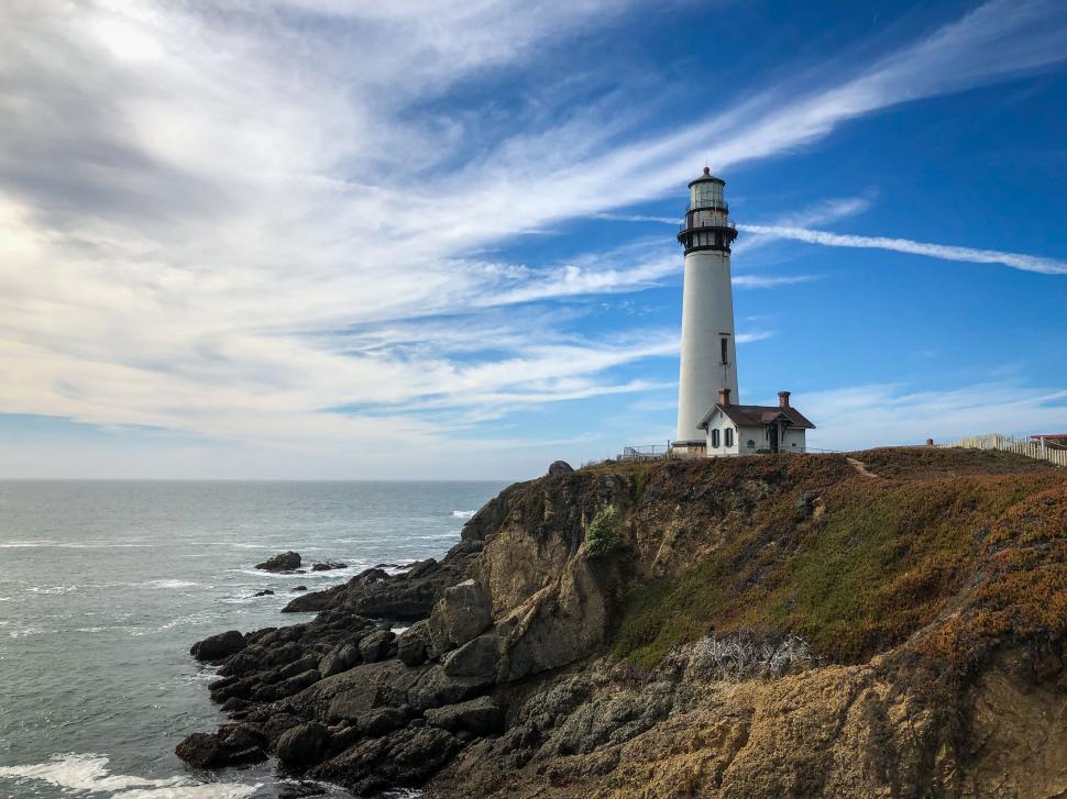 Free Image of Lighthouse on cliff over ocean view 