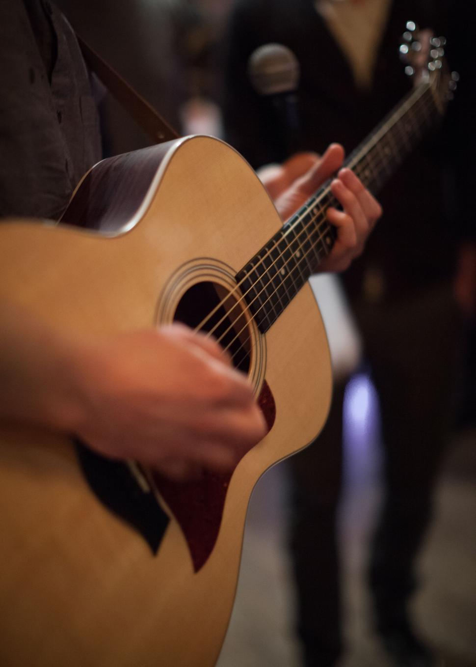 Free Image of Close-up of a musician playing guitar 