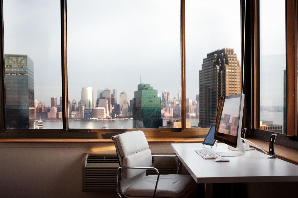 Free Image of Modern workspace with cityscape view 