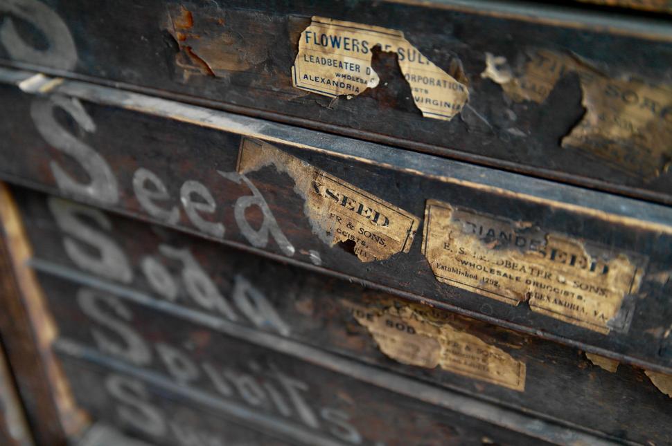 Free Image of Aged drawer labels in a rustic setting 