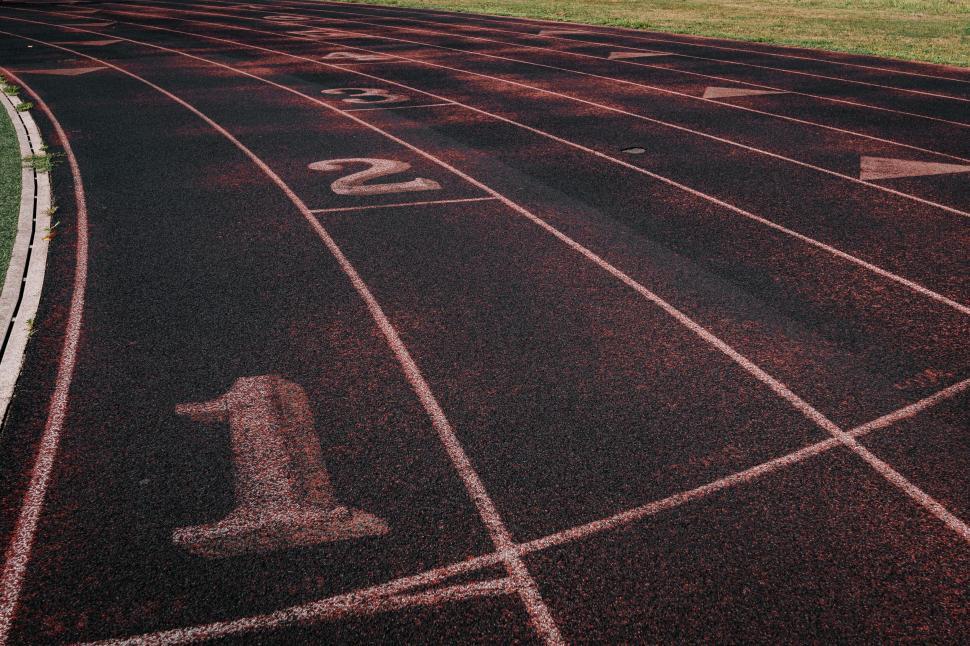 Free Image of Empty running track lanes number 1 to 6 