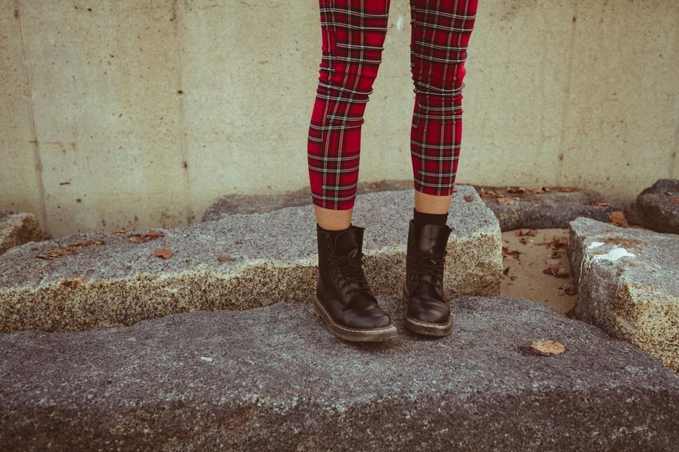 Free Image of Casual red plaid pants and combat boots 