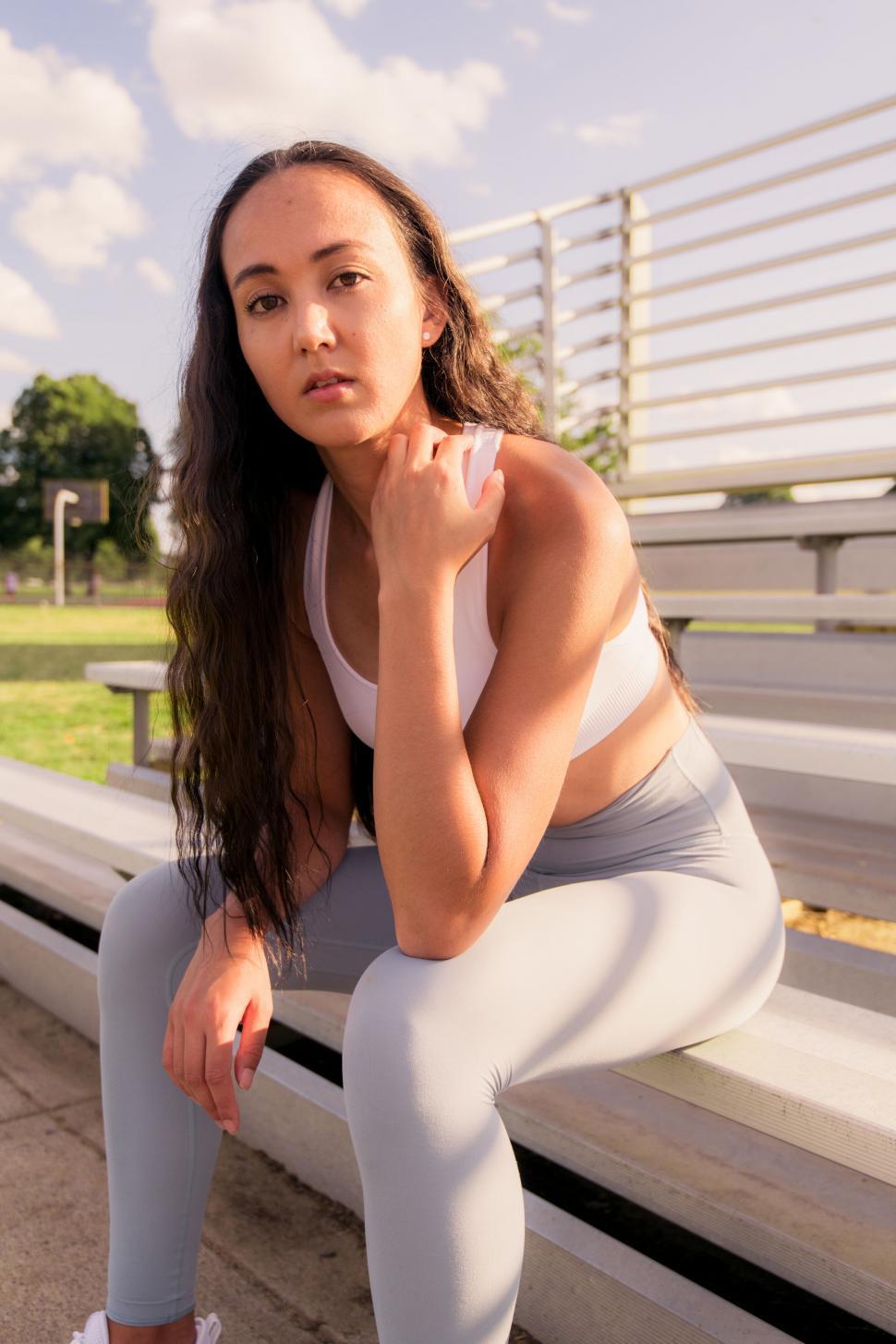 Free Image of Athletic woman resting at the stadium 