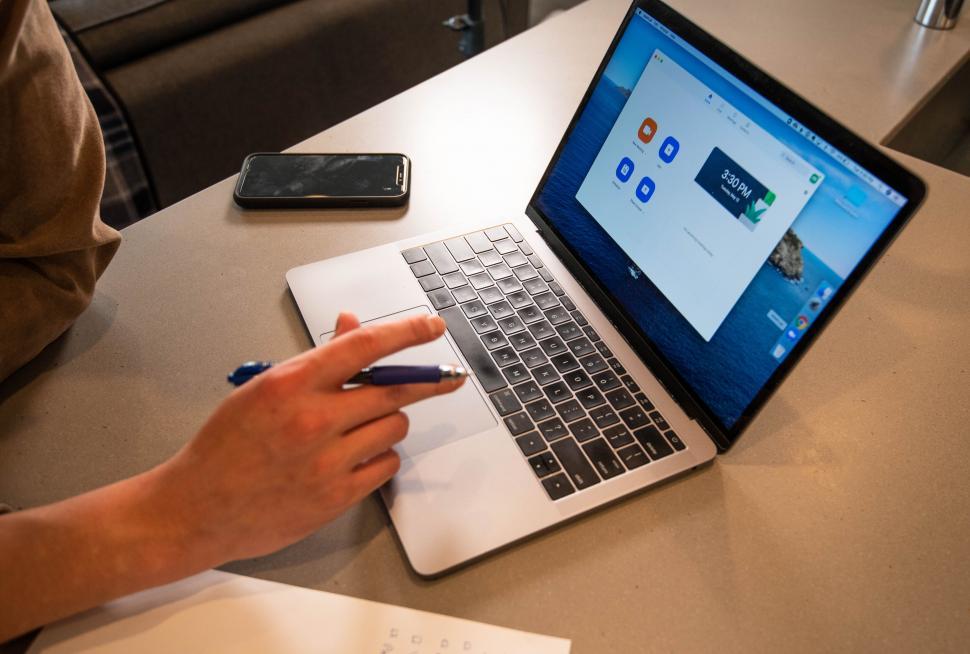 Free Image of Laptop with blue website homepage on the screen 