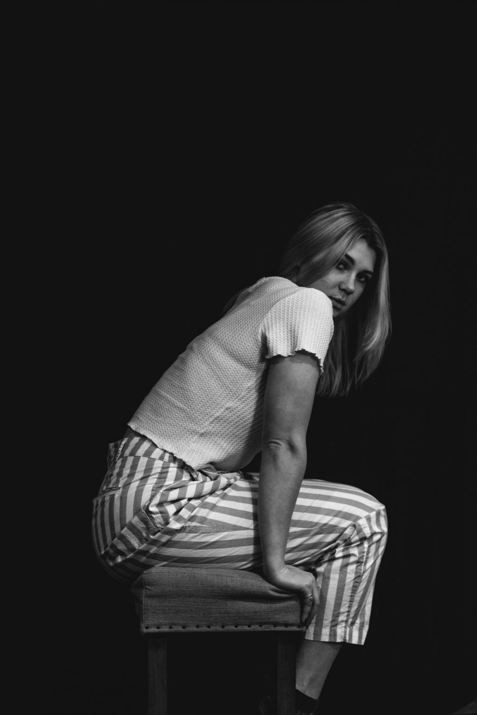 Free Image of Black and white portrait of seated woman 