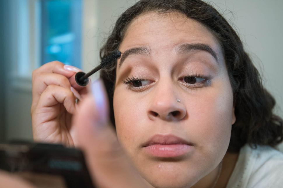Free Image of Close-up of woman applying mascara 