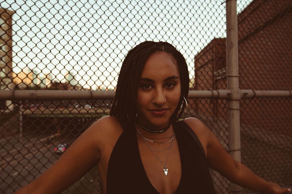 Free Image of Woman against urban backdrop at twilight 
