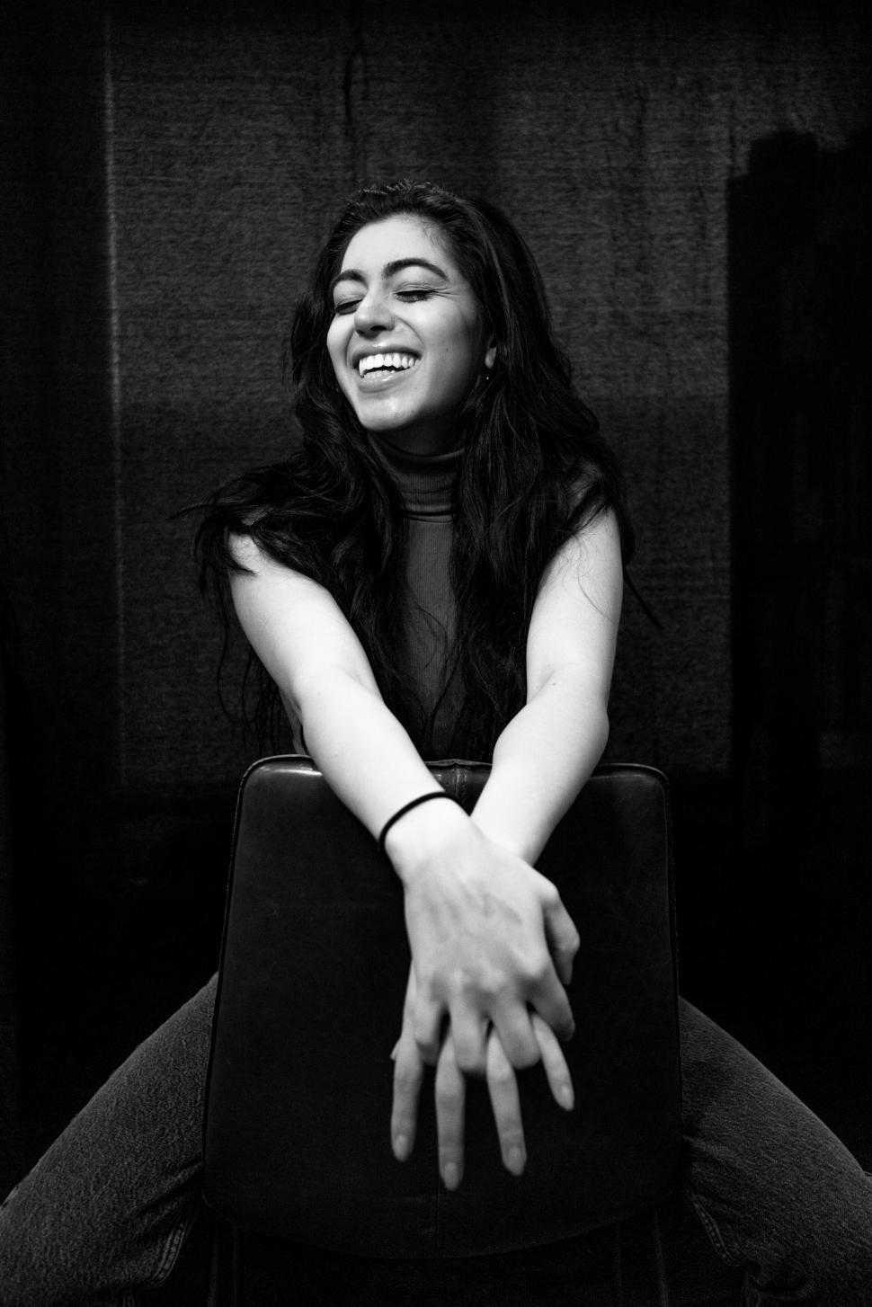 Free Image of Laughing girl with long hair in B&ampW 