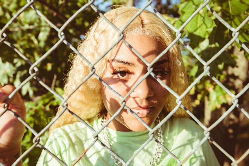 Free Image of Woman with intriguing blonde curls obscured 