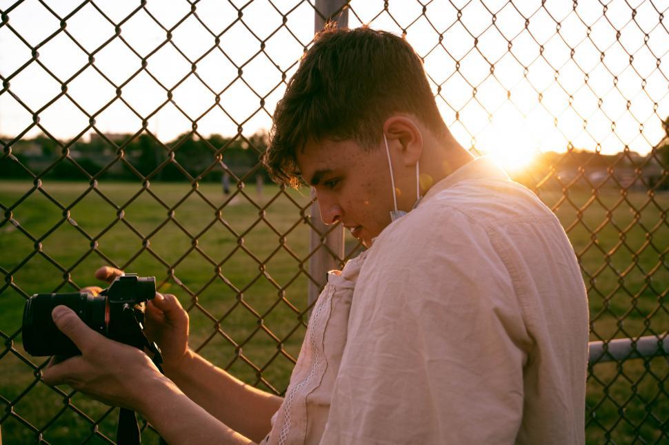 Free Image of Photographer capturing the sunset hues 