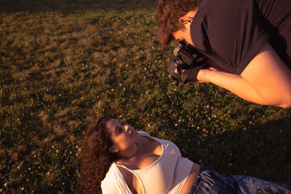 Free Image of Photographer focusing on a female subject 
