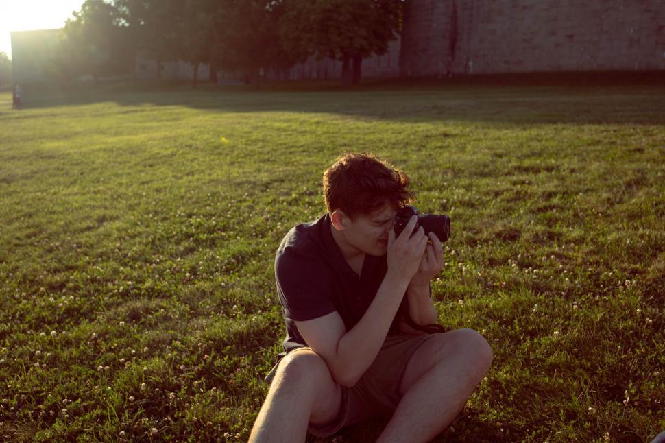 Free Image of Photographer taking pictures in nature at dusk 