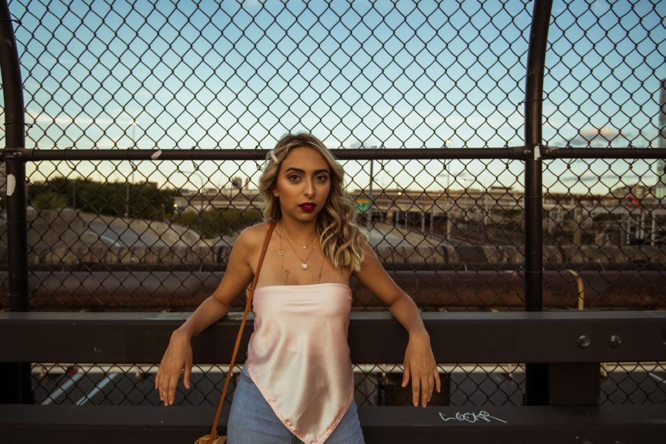 Free Image of Fashionable woman on urban overpass 