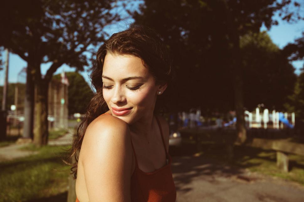 Free Image of Smiling woman in golden hour light 