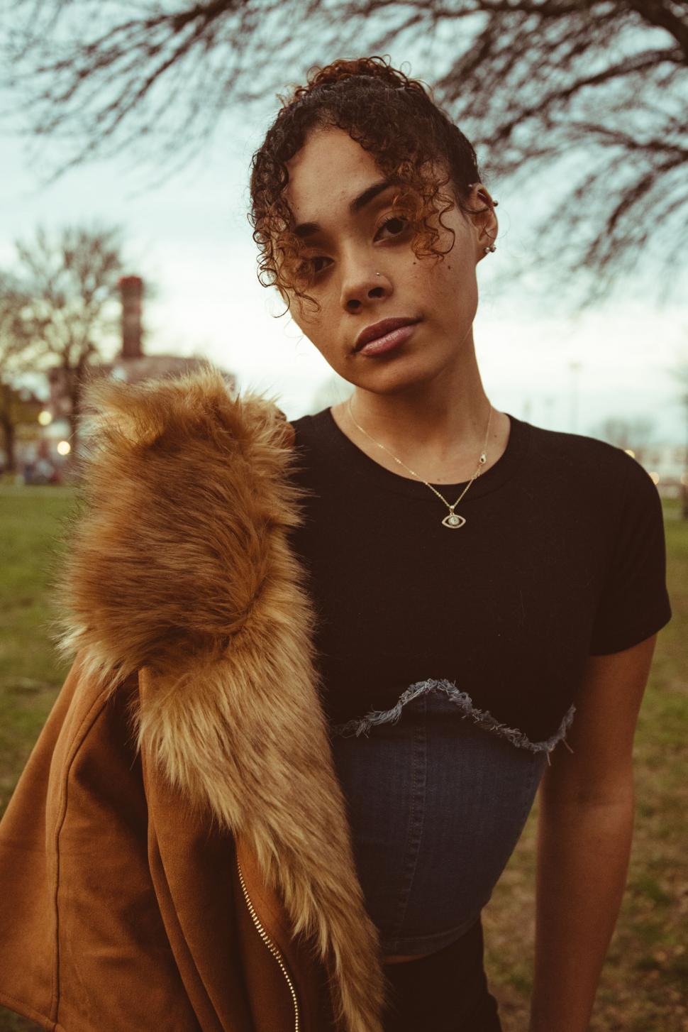 Free Image of Woman with fur collar in outdoor setting 