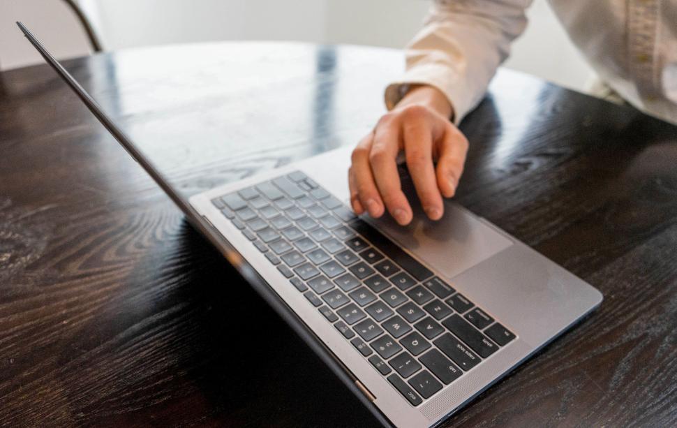 Free Image of Working on a laptop at a modern desk 