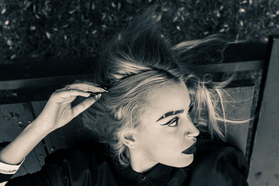 Free Image of Black and white photo of woman lying down 