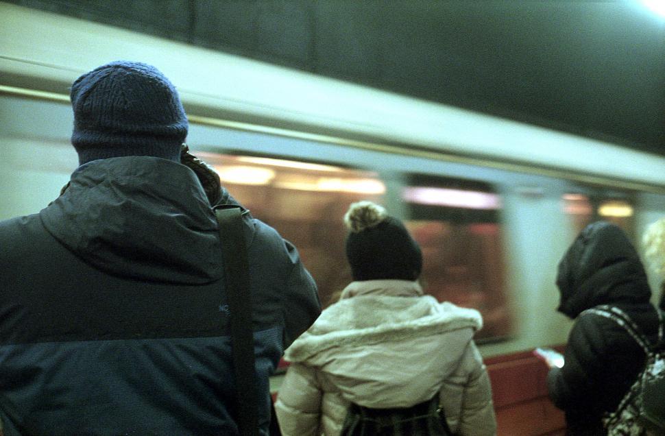 Free Image of Commuters in a subway train station 