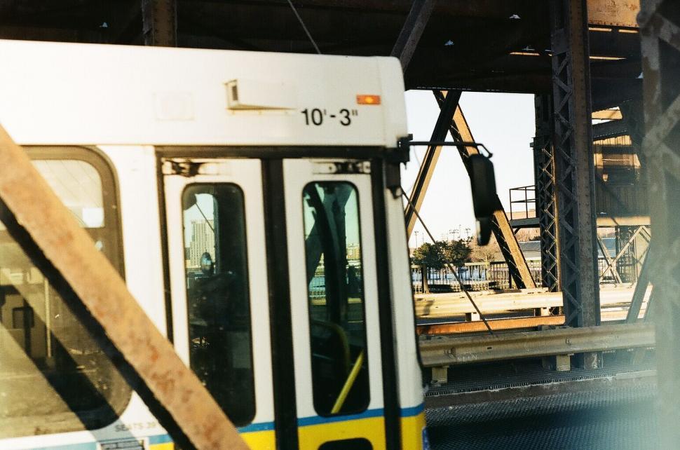Free Image of City train approaching under the bridge 