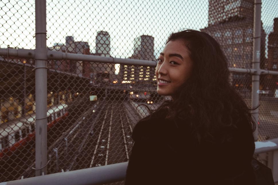 Free Image of Woman looking over shoulder at dusk 