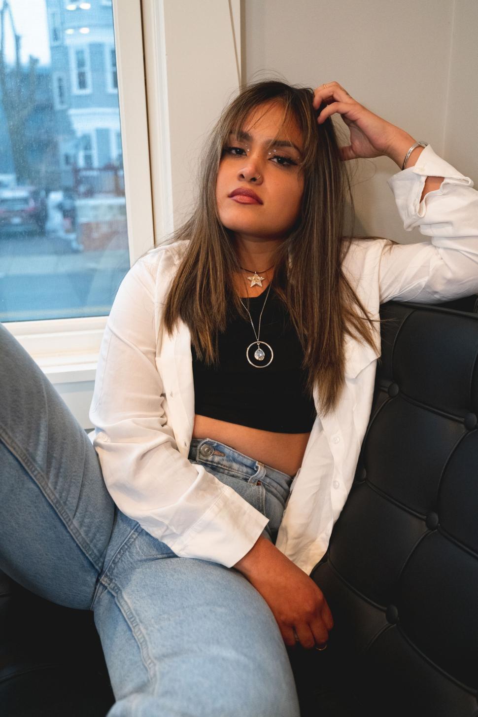 Free Image of Stylish young woman posing indoors 