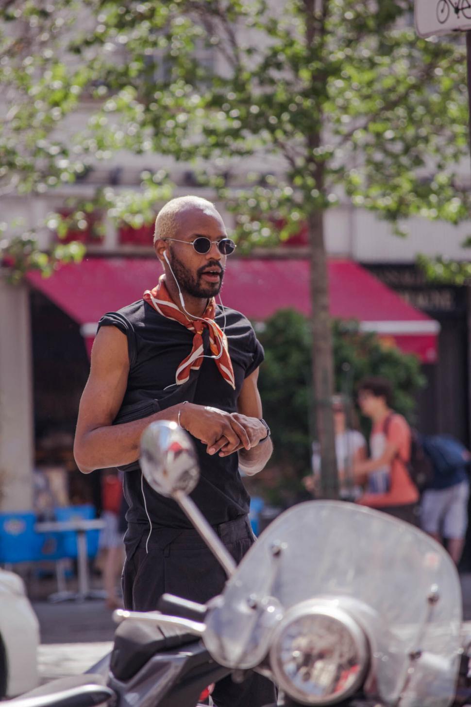 Free Image of Man on scooter wearing sunglasses 