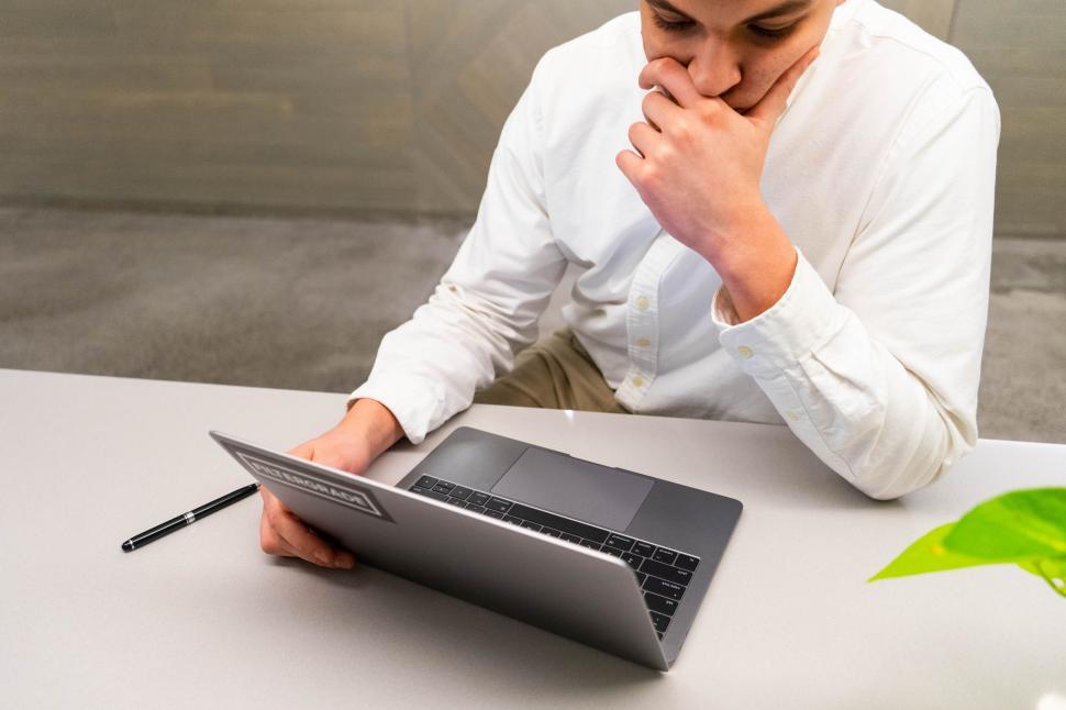 Free Image of Professional working with a stylus on a laptop 