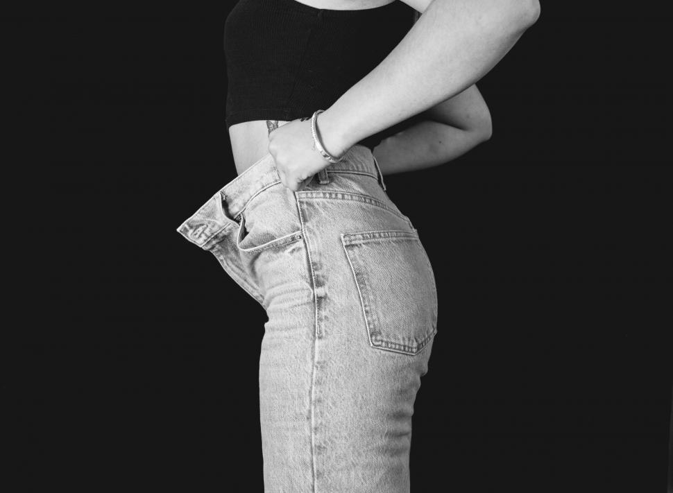 Free Image of Woman in a casual outfit posing 