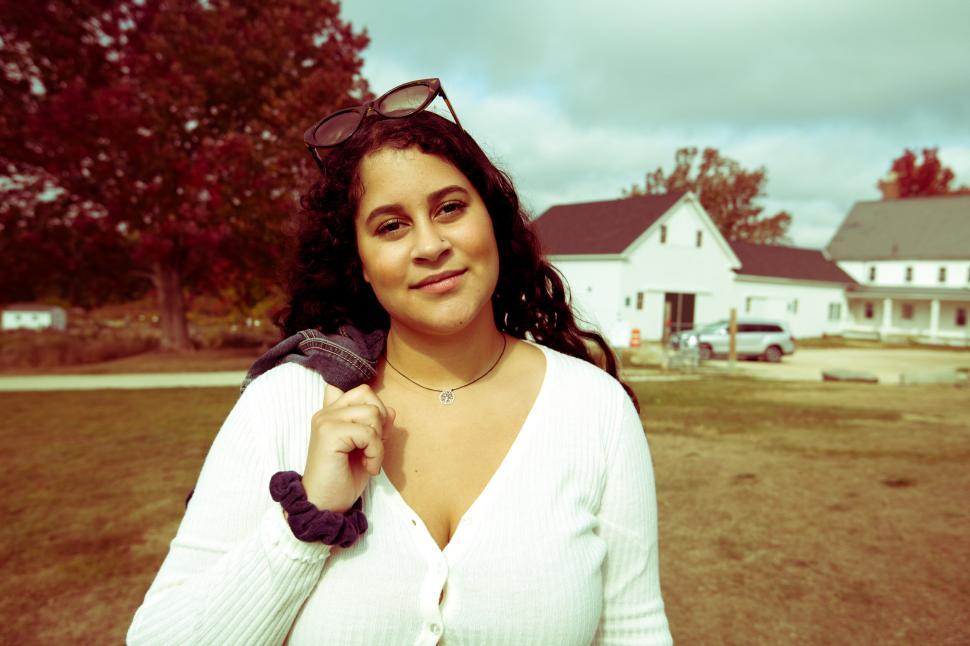 Free Image of Woman with sweater in autumn setting 
