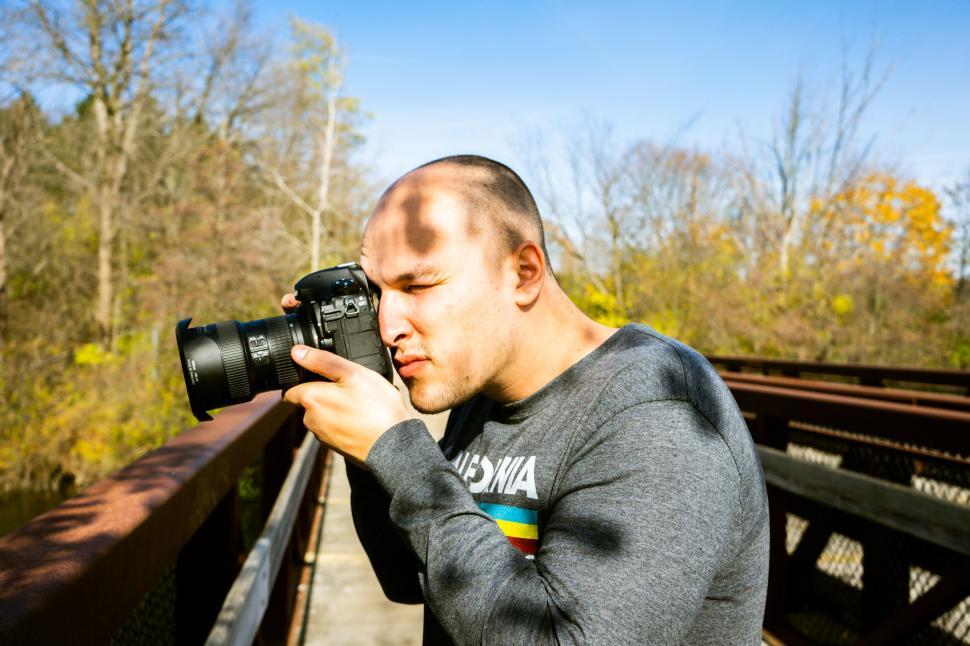 Free Image of Photographer taking a picture outdoors 