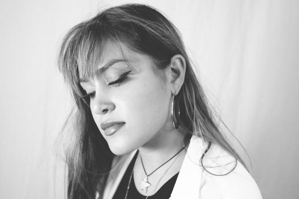 Free Image of Contemplative woman with glittery makeup 