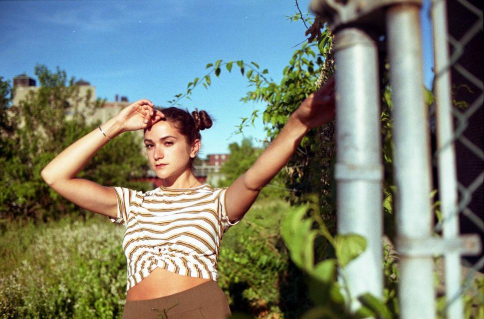 Free Image of Woman posing in urban outdoor setting 
