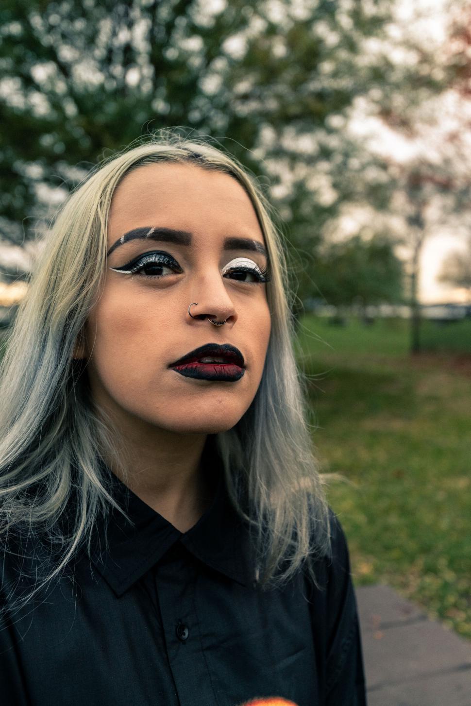 Free Image of Woman with dramatic makeup in natural light 