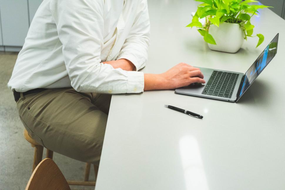 Free Image of Man working on laptop in a modern office 