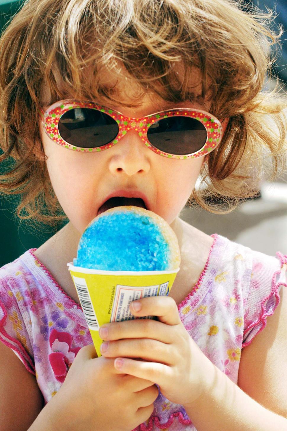 Free Image of Child eats snow cone 